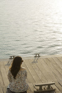 Rear view of woman looking at sea