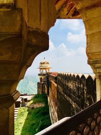 Fort seen through arch against sky