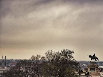 Low angle view of bare trees against sky