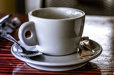 Close-up of coffee cup on table