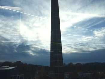 Low angle view of building against cloudy sky