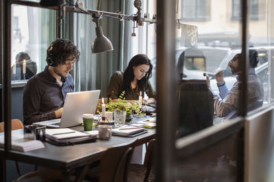 Business people working at table in creative office