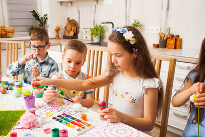 Cute kids painting at home