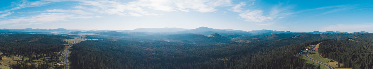 Panoramic view of landscape against cloudy sky