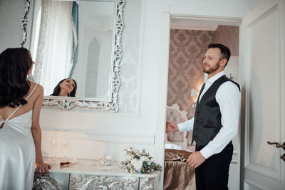 Young couple standing in corridor