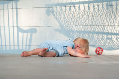 Woman lying down on floor