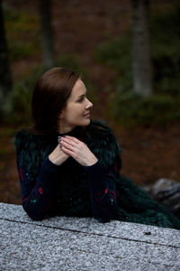 Portrait of young woman looking away