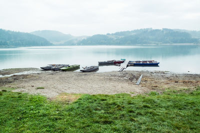 Scenic view of boats in lake