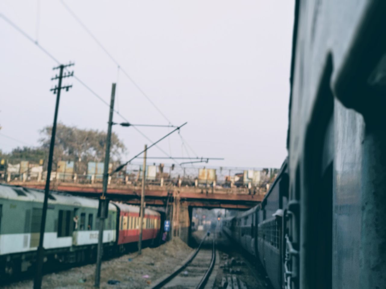 RAILROAD TRACKS AGAINST SKY IN CITY