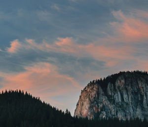 Low angle view of silhouette rocks against sky during sunset