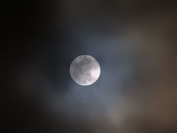 Low angle view of moon against sky at night