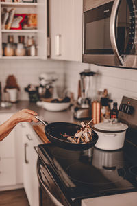 Midsection of preparing food at home