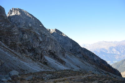 Low angle view of mountain range against clear sky