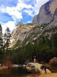 Tourists on rocky mountains