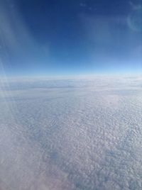 Scenic view of snow covered landscape against sky