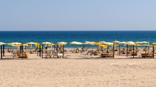 Scenic view of beach against clear sky