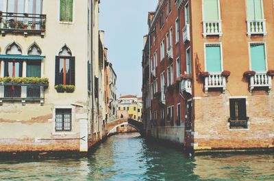 Canal amidst buildings in city