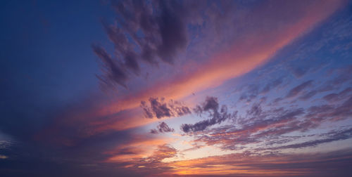 Low angle view of dramatic sky during sunset