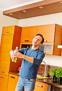 Portrait of smiling young man holding food