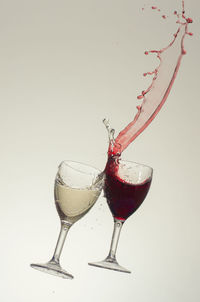 Close-up of red wine against white background