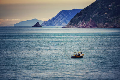 Scenic view of sea against mountain range