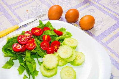 High angle view of fruits in plate on table