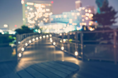 Defocused image of illuminated street at night