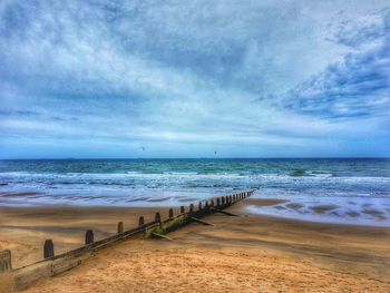 Scenic view of beach against sky