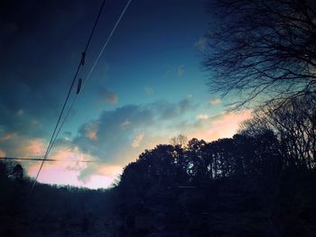 Low angle view of electricity pylon against sky