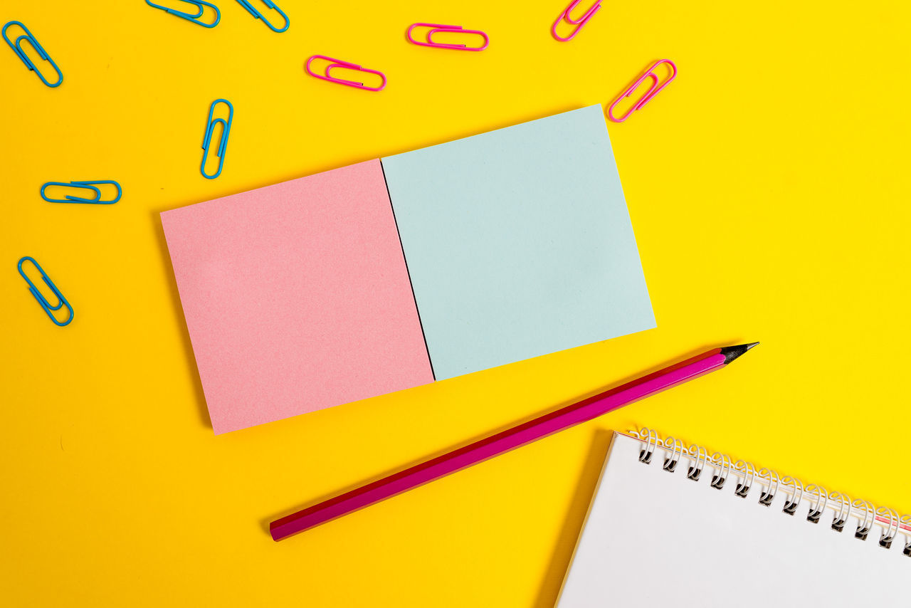 CLOSE-UP OF YELLOW PENCILS ON TABLE