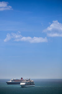 Ship sailing on sea against sky