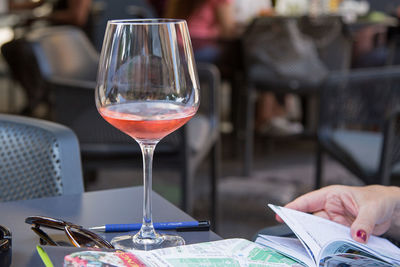 Close-up of wine glasses on table at restaurant