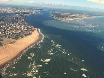 High angle view of sea and city