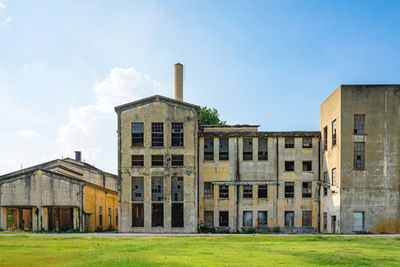 Exterior of abandoned building against sky