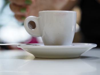 Close-up of coffee cup on table