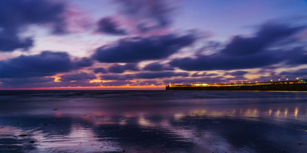 Scenic view of sea against dramatic sky