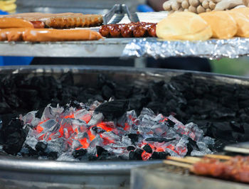 Grilled meat on a hot grill. specialty meat sold as street food.