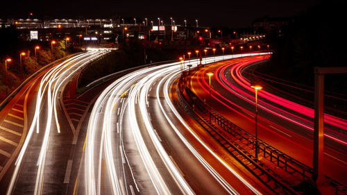 High angle view of light trails on road at night