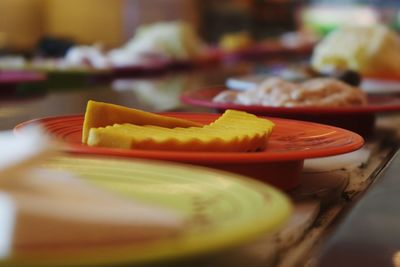 Close-up of orange slice in plate on table