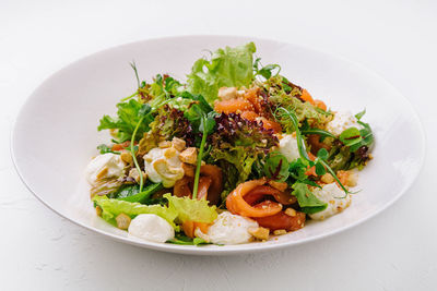 High angle view of food in plate on white background