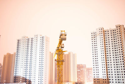 Low angle view of buildings against clear sky in city