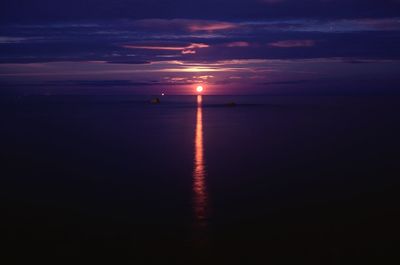 Scenic view of sea against sky at night