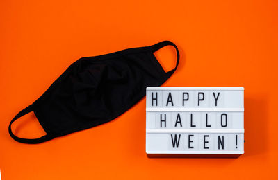 High angle view of text against orange background