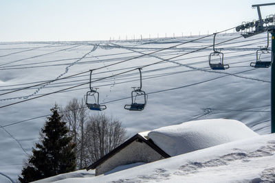 Chairlift in the woods of the asiago plateau, vicenza, italy