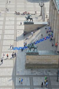 High angle view of people walking on road