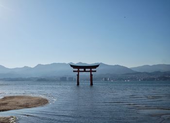 Scenic view of sea against clear blue sky