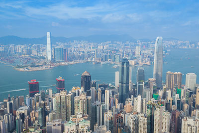 Aerial view of city and buildings against sky