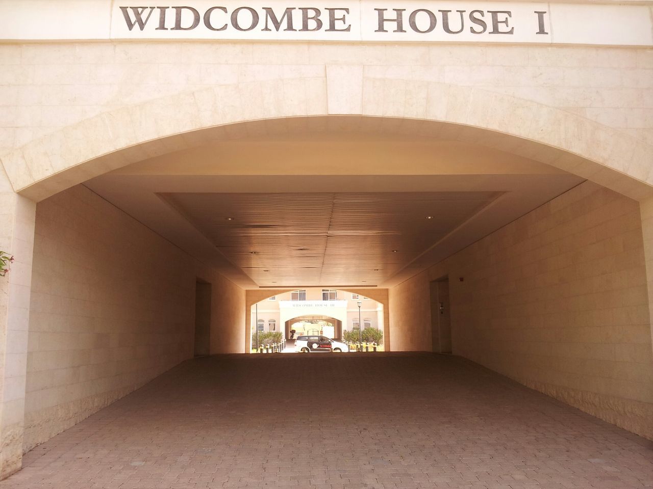 indoors, architecture, arch, built structure, ceiling, the way forward, corridor, door, empty, wall - building feature, entrance, tunnel, wall, diminishing perspective, illuminated, building, archway, interior, no people, absence