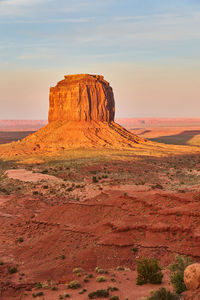 Rock formations on landscape against sky