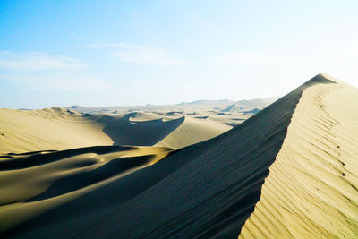 Scenic view of desert against sky